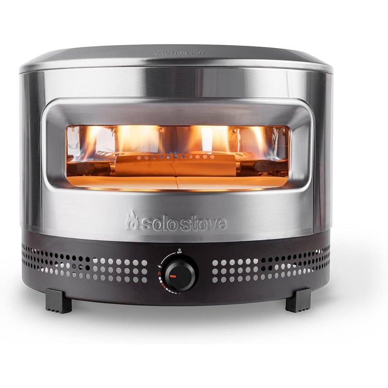 Solo Stove Pi Prime propane pizza oven in stainless steel with flame visible inside, product photo